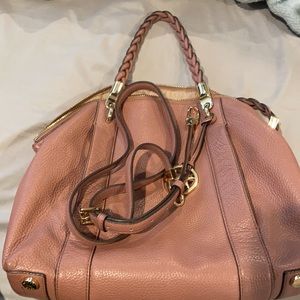 Mauve color. U can wear it as a crossbody or carry it as a tote.smoke free